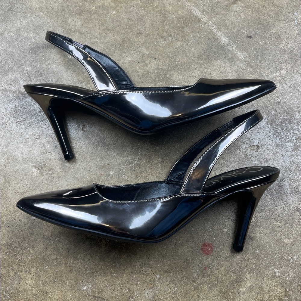 Calvin Klein Metallic Slingback Heels
Size: 9 - Picture 3 of 7